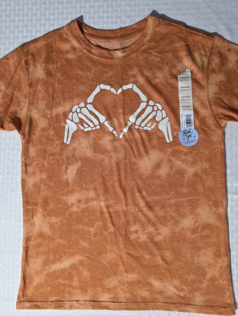 SO Orange Tie-Dye Tee with White Skeleton Hand Heart Graphic